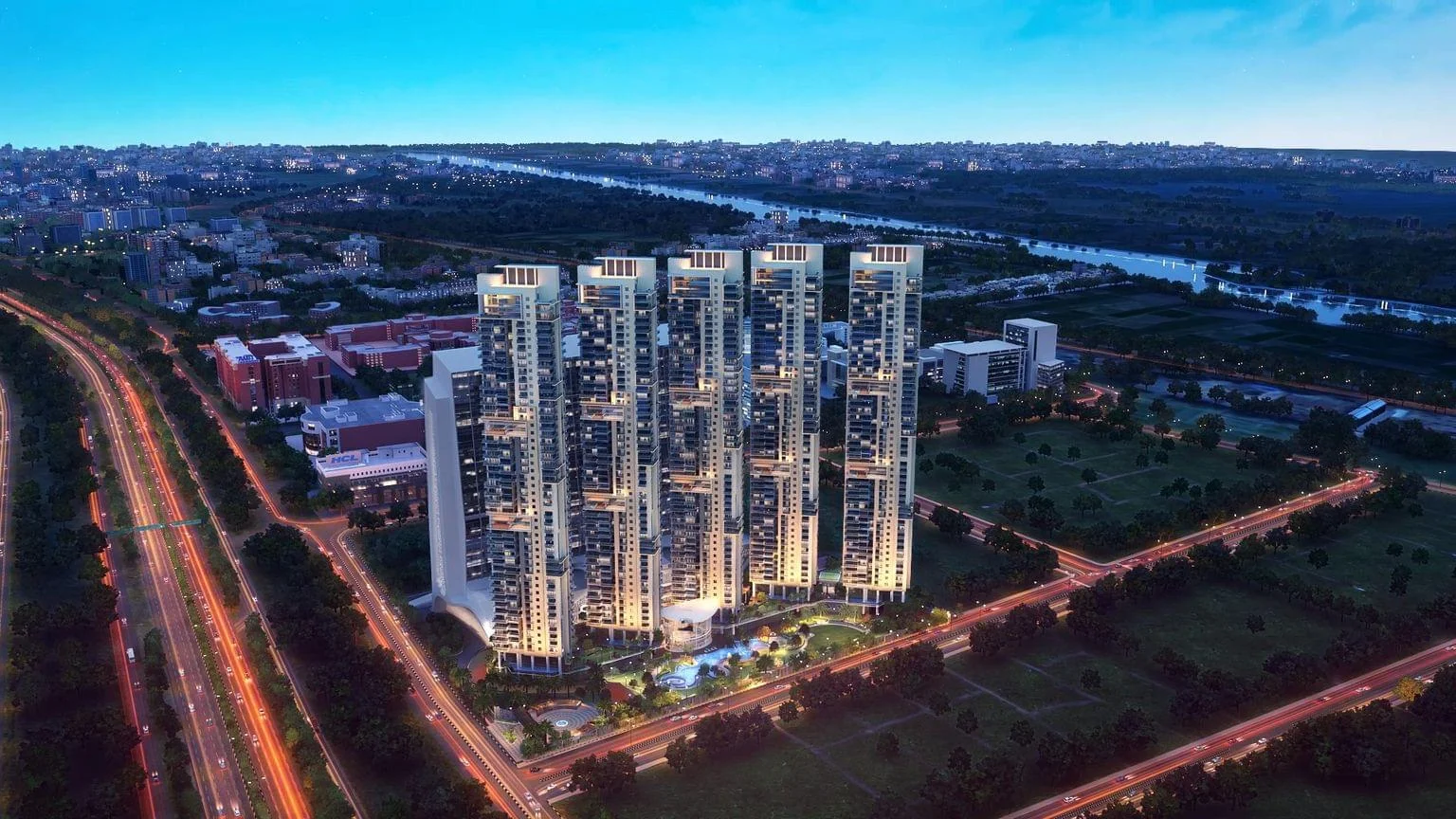 Illuminated luxury residential towers at dusk beside landscaped gardens