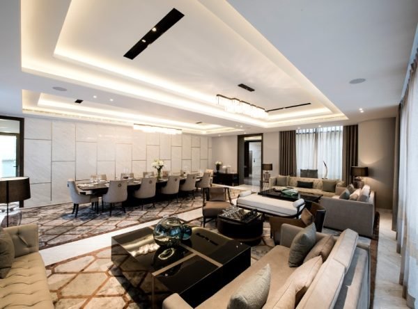 Formal dining and lounge arrangement inside a duplex residence